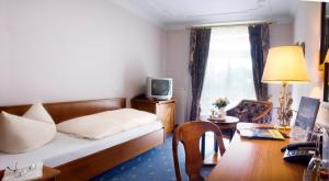 TV a/nebo společenská místnost v ubytování Post-Hotel