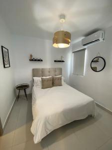 Katil atau katil-katil dalam bilik di Family apartment in Punta Cana