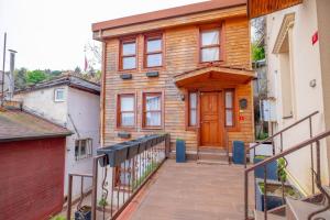 a house with a wooden door and a balcony at Bosphorus view willas in Istanbul