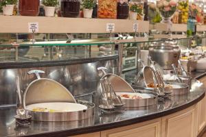 a restaurant kitchen with several dishes in sinks at Konak Hotel Taksim in Istanbul