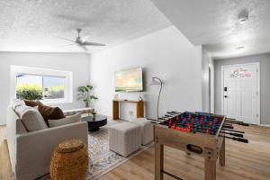a living room with a chess board on a table at Stylish Renovation, Perfect for Families & Pets, Garage Parking, Sleeps 10 in Boise +33 photos