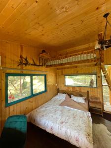 Postel nebo postele na pokoji v ubytování The Realm of Abundance Cottage