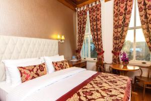 Ένα ή περισσότερα κρεβάτια σε δωμάτιο στο Mom Hotel Büyükada