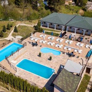an aerial view of a swimming pool with a resort at Apartman Elena Sunčani Breg Vrdnik in Vrdnik