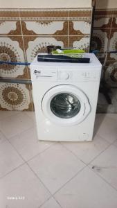 a white washing machine sitting in a room at Haute Anza in Agadir