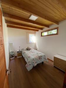 a bedroom with a bed and a window at Cómoda cada modular in San Esteban +17 photos