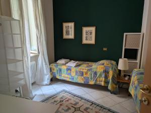 Postel nebo postele na pokoji v ubytování La dimora nel borgo Orvieto