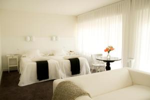 Ένα ή περισσότερα κρεβάτια σε δωμάτιο στο H & R Estrella del Bajo Carrión