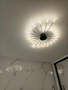 a light on the ceiling of a bathroom at Olga Luxury Apartment in Paralia Katerinis