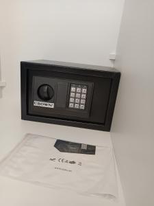 a microwave oven sitting on top of a table at Olga Luxury Apartment in Paralia Katerinis +64 photos