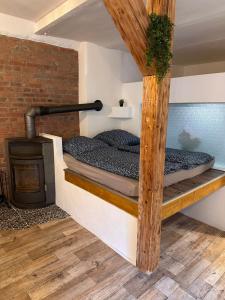 En eller flere senge i et værelse på WOW schicke Loftwohnung, Appartement Wifi, Minibar