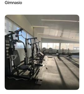 a gym with several tread machines in a room at Lujoso Apartamento en Eco Distrito in Tegucigalpa