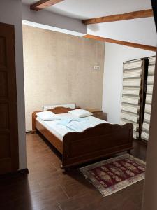 Postel nebo postele na pokoji v ubytování Pensiunea Stan