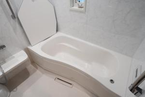 a white bathroom with a tub and a toilet at Akikawa Villas1 - Vacation STAY 18834 in Yuge