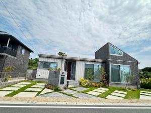 a house with a lawn in front of it at Akikawa Villas 4 - Vacation STAY 18837 in Yuge