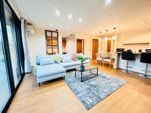 a living room with a couch and a table at Akikawa Villas 9 - Vacation STAY 18842 in Yuge