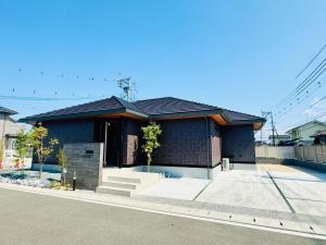 a brick house with a black roof at Akikawa Villas 12 - Vacation STAY 18845 in Fukumoto