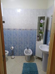 a bathroom with a toilet and a sink at Spacious Apartment Casablanca in Casablanca