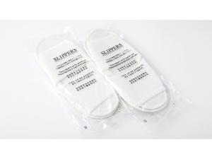 two white toothbrushes sitting in a plastic bag at Smile Hotel Shimonoseki - Vacation STAY 96732v in Shimonoseki
