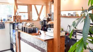 a kitchen with a counter with many items on it at Minshuku Misakiso - Vacation STAY 89790v in Miyazaki