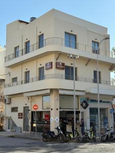 a building with motorcycles parked in front of it at Chanioporta suites in Heraklio