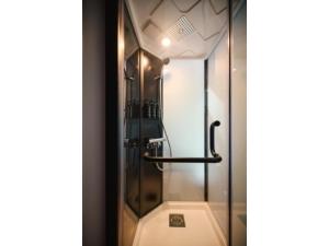 a shower in a bathroom with a glass door at BASE LAYER HOTEL NAGOYA NISHIKI - Vacation STAY 98087v in Nagoya