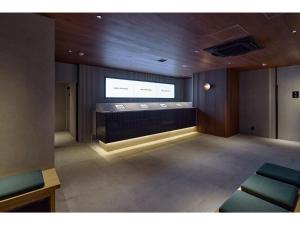a waiting room with a large screen in the ceiling at BASE LAYER HOTEL NAGOYA NISHIKI - Vacation STAY 98805v in Nagoya +8 photos
