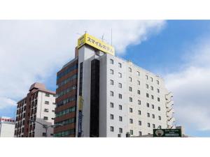 a building with a sign on the top of it at Smile Hotel Utsunomiya Higashiguchi - Vacation STAY 00213v in Utsunomiya