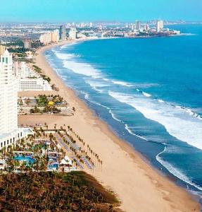 an aerial view of a beach and the ocean at Marina Cerritos - Blanco Celeste - 5 Albercas in Mazatlán