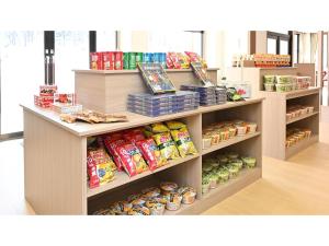 a store shelf filled with lots of food at Komakusa Hotel - Vacation STAY 03227v in Matsumoto