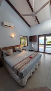 a bedroom with a large bed in a room at Bularangi Villa, Fiji in Rakiraki