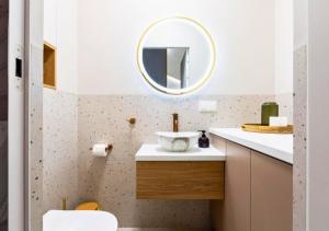 a bathroom with a sink and a mirror at Domek Reset Kaszuby in Łączyno +23 photos