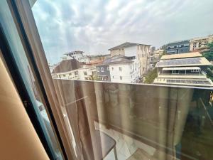 a view of a city from a window at Charleys Oasis in Lagos