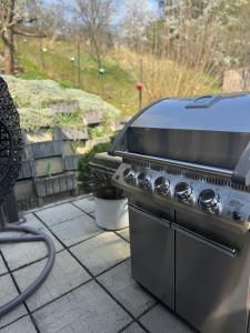 a grill sitting on top of a patio at Ubytování na Lesní in Luhačovice