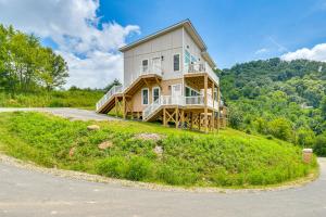 a large house on top of a hill at Mtn Views and Stunning Fall Hikes Maggie Valley Apt in Maggie Valley