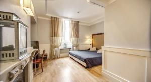 Posteľ alebo postele v izbe v ubytovaní 939 Hotel