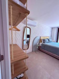 a bedroom with a bed and a mirror in it at Casa Fortim Eco Village in Fortim +36 photos