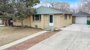 a house with a driveway in front of it at Wild West-Inspired Family Home in Denver