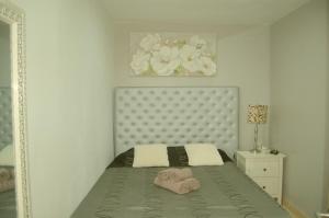 a bedroom with a bed with towels on it at casa vacacional con piscina privada in Sant Cebrià de Vallalta +28 photos