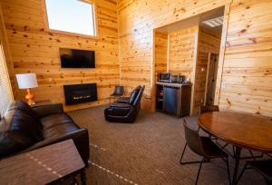 a living room with a couch and a table at Bryce Canyon Inn in Tropic