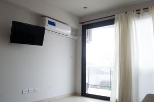 TV a/nebo společenská místnost v ubytování Departamento 2 AMB en Vista Tres