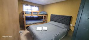 a bedroom with two bunk beds and a window at Gasb in Choele Choel