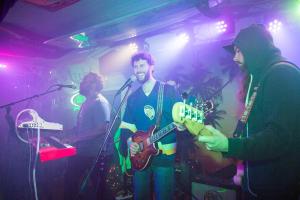 a group of people singing in a room with a microphone at The Magnolia Mansion 6 Minutes to Broadway on 4 Acres in Nashville
