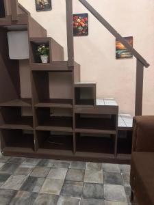 a stair case with shelves in a living room at abajo española in Santo Domingo