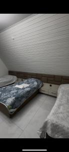 a bedroom with two beds in a room at A-Frame Yaşam in İsmayıllı
