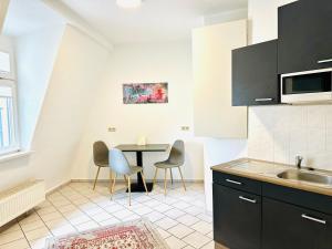 Kuchyň nebo kuchyňský kout v ubytování Möblierte Wohnung im Stadtzentrum