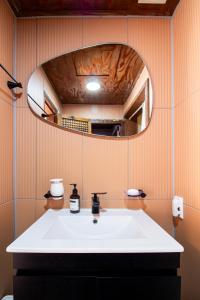 a bathroom with a white sink and a mirror at Eosahwa in Jeonju