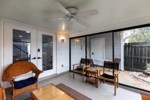 a screened in porch with a table and chairs at Newly Renovated, Dog Friendly, Stocked Kitchen in Dothan