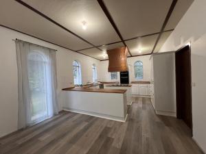 a kitchen with white cabinets and a counter top at OUYEN MOTEL in Ouyen