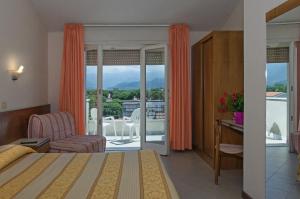 Postel nebo postele na pokoji v ubytování Hotel Montecarlo